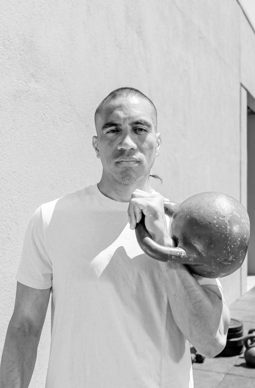 Hank Frost holding a kettlebell